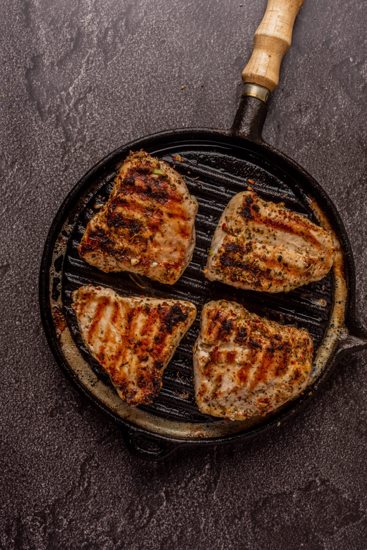 chicken breasts cooked on a grill pan